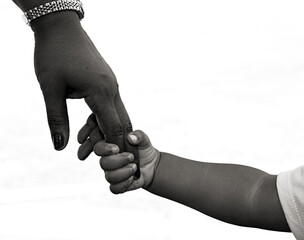 African-American family: child is holding mothers hand - black and white