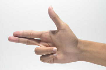 Human hand in shooting gesture isolated on white background