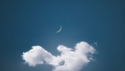 Obraz na płótnie Canvas Crescent moon behind the cloud.