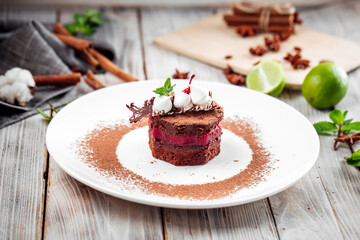 Sponge cake with berry cream in chocolate glaze