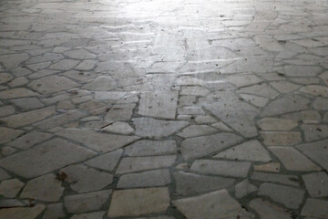 natural stone pavement reflecting daylight close up