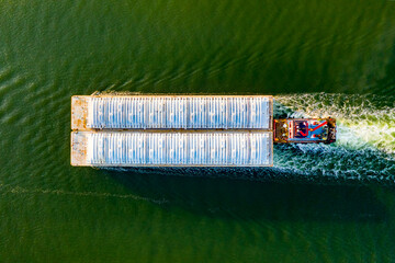 Overhead view of a shipping barge moving through the intercoastal waterway - obrazy, fototapety, plakaty