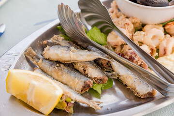 Palte of fried fish with lemon