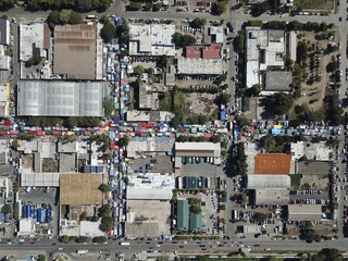 Aerial shot of an open-air Sunday flea market in a poor city