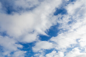 Many clouds in blue sky