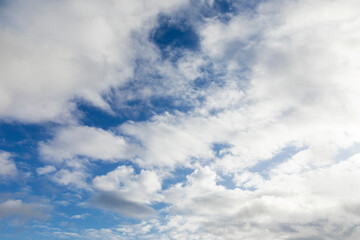 Many clouds in blue sky