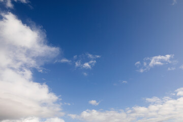 Naklejka na ściany i meble Blue sky with white clouds around