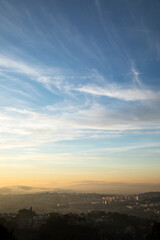 Vertical landscape with sunset sky and mountains as background
