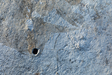 Close up detailed surface pattern and texture of concrete wall in blue and grey colours. Grunge background with copy space.