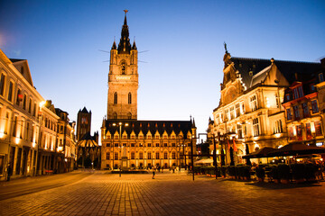 Naklejka premium Ghent’s Belfry and Sint-Baafsplein square at night, Ghent, Belgium