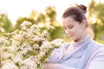 Motherhood, care, infants, summer, parenting concept - Young beautiful mom with a newborn baby in a...