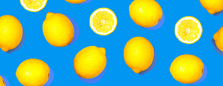 Pattern with lemon fruits. Tropical citrus on classic blue color background. © IrynaV