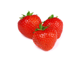 Three red strawberries isolated on a white background. Organic strawberry.Healthy food. Fresh strawberry