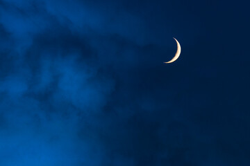 Obraz na płótnie Canvas Blue foggy sky with crescent or half moon