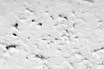 Stone wall with clay and whitewashed background texture