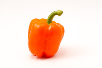 Orange bell pepper isolated on a white background