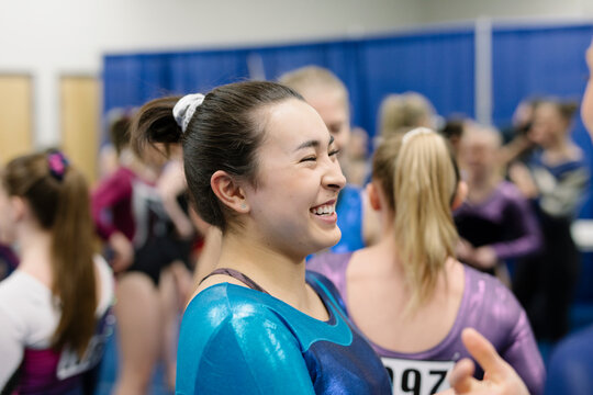 Female gymnast smiling and laughing