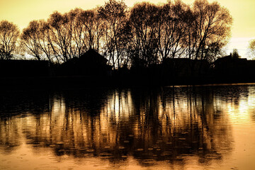 Sunset on the lake in the village