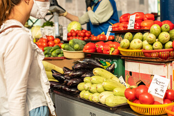 Beautiful picture of red and white tomatoes with a ot of vegetables sold on the market