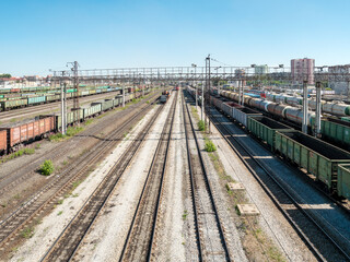 Fototapeta na wymiar Railway station, carriages, train cars, tanks, empty rails, free space.