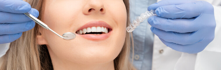 Woman having teeth examined at dentists
