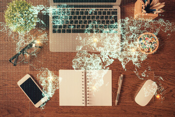 Social network hologram drawings over computer on the desktop background. Top view. Double exposure.