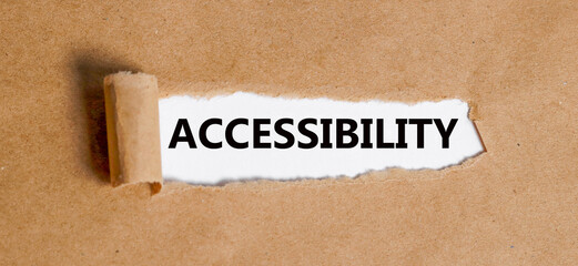 ACCESSIBILITY text is written on the background of a businessman. Business concept.Torn paper with on a white background with a frame for text. Text ACCESSIBILITY