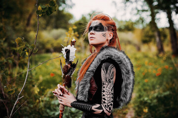 Girl in ethnic scandinavian costume in the forest