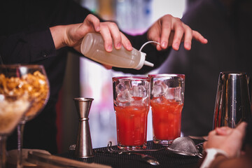 bartender pouring cocktail