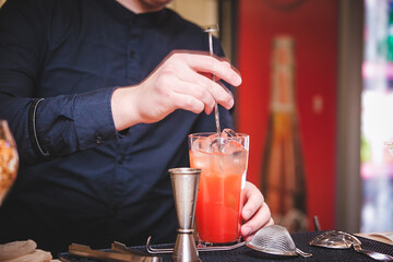 bartender pouring cocktail