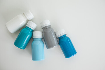 Set of colorful gouache paints on white background. Children's drawing