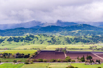 Aerial view of agricultural fields, Santa Cruz mountains in the background, south San Francisco bay, San Jose, California