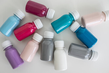 Set of colorful gouache paints on white background. Children's drawing