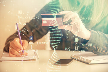 Multi exposure of woman on-line shopping holding a credit card and DNA drawing. Medical education...