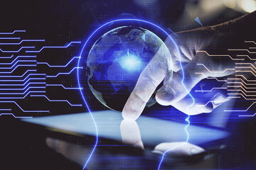 Double exposure of man's hand holding and using a digital device and brain hologram drawing. Data concept.