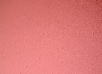 Drops of water in the form of a clock on a red background