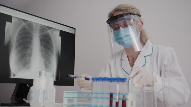Covid 19 Coronavirus Scientists test for Covid-19 or Corona virus By using science tubes to research and treat illness in a laboratory or hospital. Medical treatment concepts