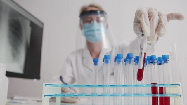 Covid 19 Coronavirus Scientists test for Covid-19 or Corona virus By using science tubes to research and treat illness in a laboratory or hospital. Medical treatment concepts