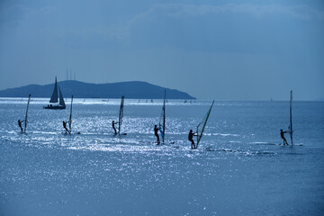 surfer group on the sea