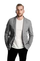 A classy handsome Scandinavian guy
with a beard looking serious at the camera wearing a
grey coat with hands in his pocket.