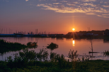 Sunrise bathing a lake in orange light
