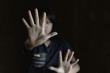 Child showing hand for Stop violence and abused children concept.