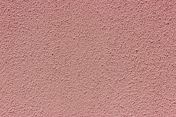 Pink embossed stucco on the wall.