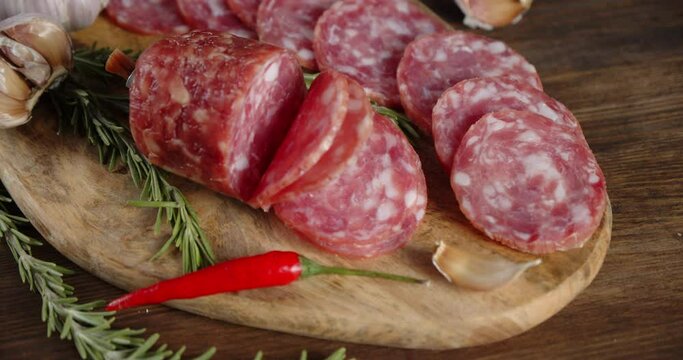 Sliced salami with rosemary, garlic and chilli.