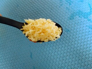 a spoonful of cooked rice