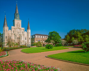 Fototapeta na wymiar The St. Louis Cathedral is surrounded by a beautiful garden in Jackson Square.