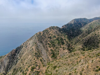 Fototapeta na wymiar Aerial view of Santa Catalina Island mountains and trails with ocean on the background. California, USA