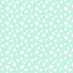 グリーン背景のラフなドットパターン　シームレス