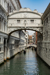 Fototapeta na wymiar Canals of Venice during the day in high resolution, vertical orientation