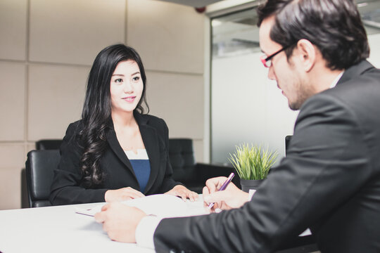Job interview businessman listen to candidate answers and check information